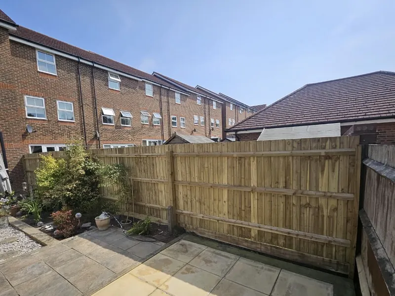 New closeboard fence at the back of a terraced garden